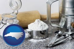 north-carolina map icon and baking equipment, flour, and salt